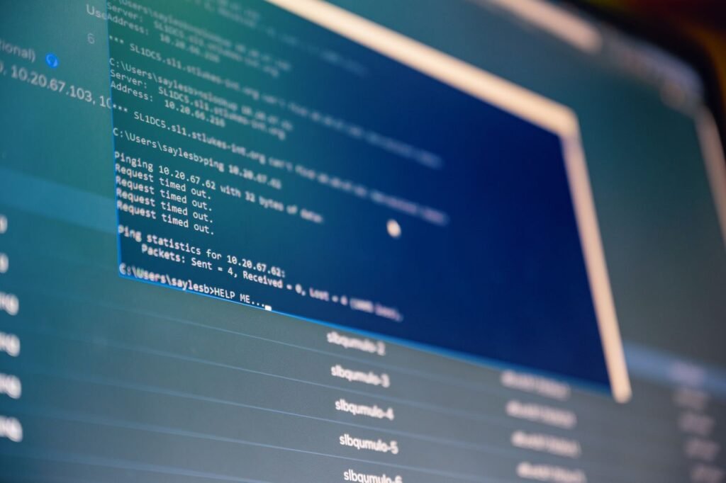 From below of monitor of modern computer with opened files on blue screen